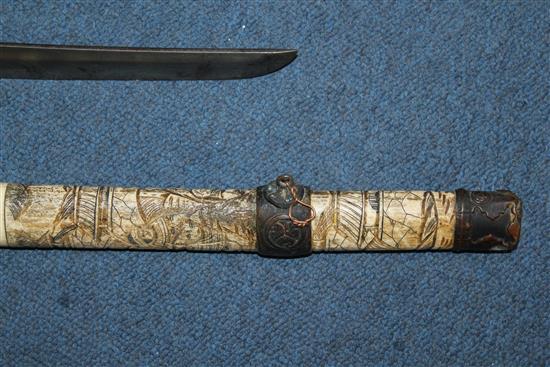 An early 20th century Japanese bone wakizashi and another